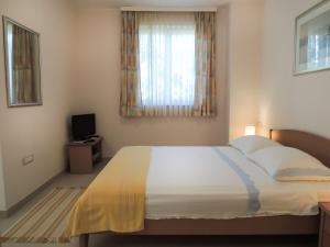 Posteľ alebo postele v izbe v ubytovaní Apartments Lada
