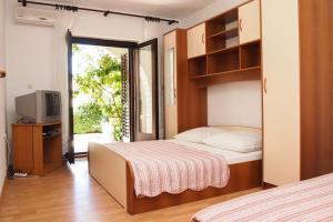Postel nebo postele na pokoji v ubytování Apartments Ruza