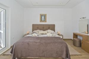 Postel nebo postele na pokoji v ubytování Apartments Nadi