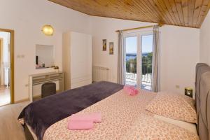 Postel nebo postele na pokoji v ubytování Apartments Nadi