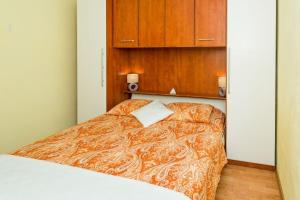 Postel nebo postele na pokoji v ubytování Apartment Angie