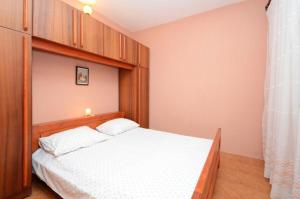 Postel nebo postele na pokoji v ubytování Apartments Lukovac