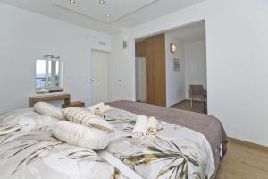 Postel nebo postele na pokoji v ubytování Apartments Nadi