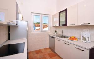 Kuchyň nebo kuchyňský kout v ubytování Apartments Nadi