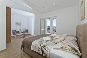 Postel nebo postele na pokoji v ubytování Apartments Nadi
