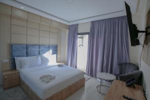 Postel nebo postele na pokoji v ubytování FEKRI HOTEL + 37 fotografií