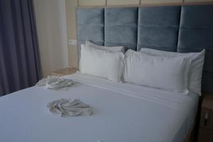 Postel nebo postele na pokoji v ubytování FEKRI HOTEL