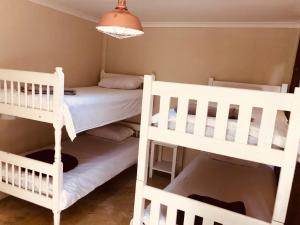 Postel nebo postele na pokoji v ubytování Island Vibe Knysna
