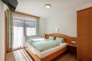 Ένα ή περισσότερα κρεβάτια σε δωμάτιο στο Haus Hanser