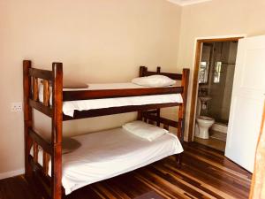 Postel nebo postele na pokoji v ubytování Island Vibe Knysna