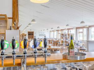 a bar in a restaurant with wine bottles at Seaside escape in Hanstholm- Type3 in Hanstholm