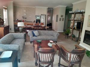 a living room with a couch and a table at Corgi Cottage in Stanford +8 photos