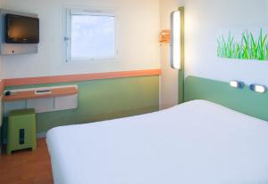 Postel nebo postele na pokoji v ubytování B&B HOTEL Annemasse Est