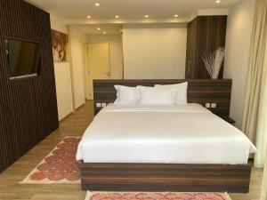 Palms Resort Assinie Managed by Accor客房内的一张或多张床位