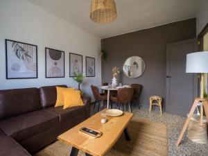 a living room with a couch and a table at Samar Retreat in Teror