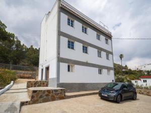 a car parked in front of a white building at Samar Retreat in Teror