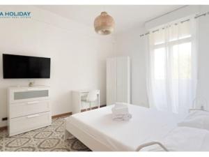 TV a/nebo společenská místnost v ubytování Ostia Holiday La Bonaccia