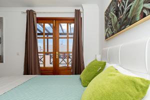 Łóżko lub łóżka w pokoju w obiekcie Apartment Limonade Deluxe Main Center Playa Blanca By PVL