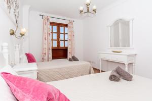 Łóżko lub łóżka w pokoju w obiekcie Apartment Limonade Deluxe Main Center Playa Blanca By PVL