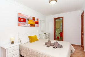 Łóżko lub łóżka w pokoju w obiekcie Apartment Limonade Deluxe Main Center Playa Blanca By PVL