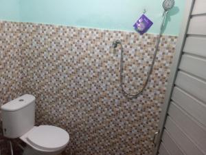 a bathroom with a shower with a toilet at Jungle Trekking & Jungle Tour only stay here if you are and you must booking jungle trekking with us in Bukit Lawang +290 photos