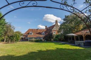 a large house with a yard with a house at Catton Old Hall Norwich in Norwich