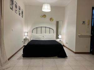 Postel nebo postele na pokoji v ubytování Arryanna Apartment