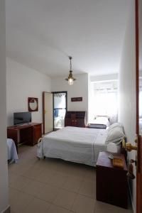 Postel nebo postele na pokoji v ubytování Hotel Barracuda