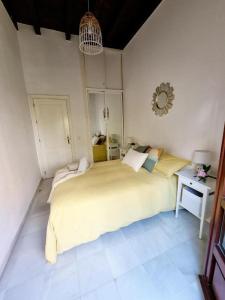 Posteľ alebo postele v izbe v ubytovaní Hostfy Mercado de Triana