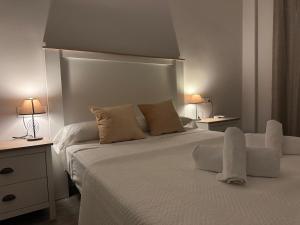 Posteľ alebo postele v izbe v ubytovaní Apartamento La Verdad