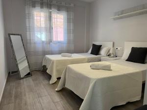 Posteľ alebo postele v izbe v ubytovaní Apartamento La Verdad