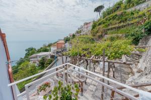 a view from the stairs of a mountain at Albergo Diffuso Bacco Furore in Furore