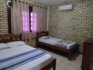 Ένα ή περισσότερα κρεβάτια σε δωμάτιο στο Linda casa próximo do Beach Park +53 φωτογραφίες