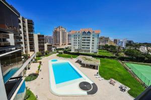 an overhead view of a swimming pool in a city at Amazing Sea View in Cascais