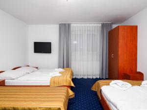 Postel nebo postele na pokoji v ubytování Giewont
