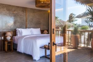 Ein Bett oder Betten in einem Zimmer der Unterkunft Yemanjá Hotel by Preabeach Experience