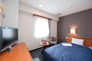 TV a/nebo společenská místnost v ubytování Hotel Unisite Sendai + 7 fotografií