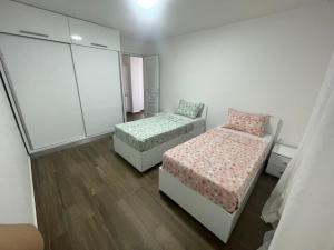 Ένα ή περισσότερα κρεβάτια σε δωμάτιο στο Élégant appart II à Bab Ezzouar