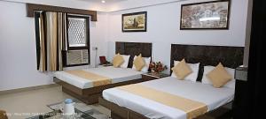 Postel nebo postele na pokoji v ubytování Hotel Su Shree Continental Dx Near New Delhi Railway Station