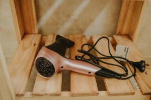 a hair dryer sitting on top of wooden cutting boards at Las Loicas Tempo in Esquel