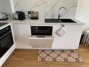 Cucina o angolo cottura di Appartement neuf, vue sur saône