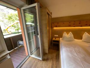 Letto o letti in una camera di Pension Ahorn