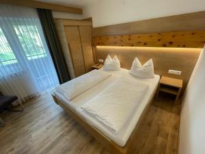 Letto o letti in una camera di Pension Ahorn