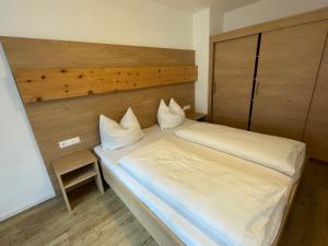 Letto o letti in una camera di Pension Ahorn
