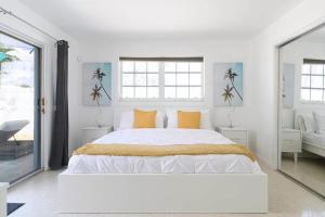 Ένα ή περισσότερα κρεβάτια σε δωμάτιο στο Ft Lauderdale Dream +14 φωτογραφίες