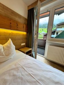 Letto o letti in una camera di Pension Ahorn