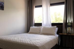 Postel nebo postele na pokoji v ubytování Hotel Boutique Bueso