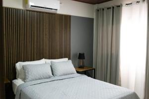 Postel nebo postele na pokoji v ubytování Hotel Boutique Bueso