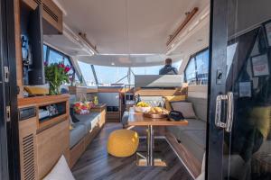 an interior of an rv with a table in it at 2BR Heated Yacht, Lymington Centre, Beautiful View in Lymington