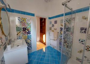 a bathroom with a sink and a shower at Palazzo Sardanelli in Pizzo +103 photos